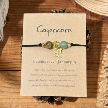 Capricorn dainty zodiac charm bracelet on kraft card