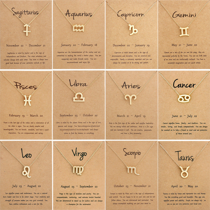 Gold zodiac symbol necklaces on meaning cards, all 12 signs
