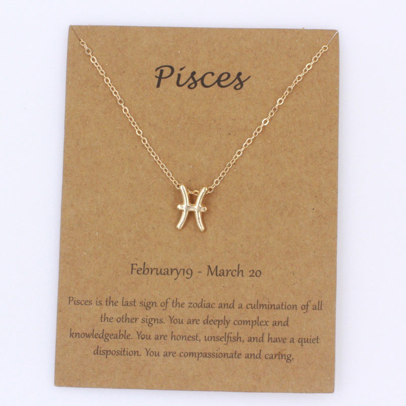 Pisces gold zodiac pendant necklace on meaning card