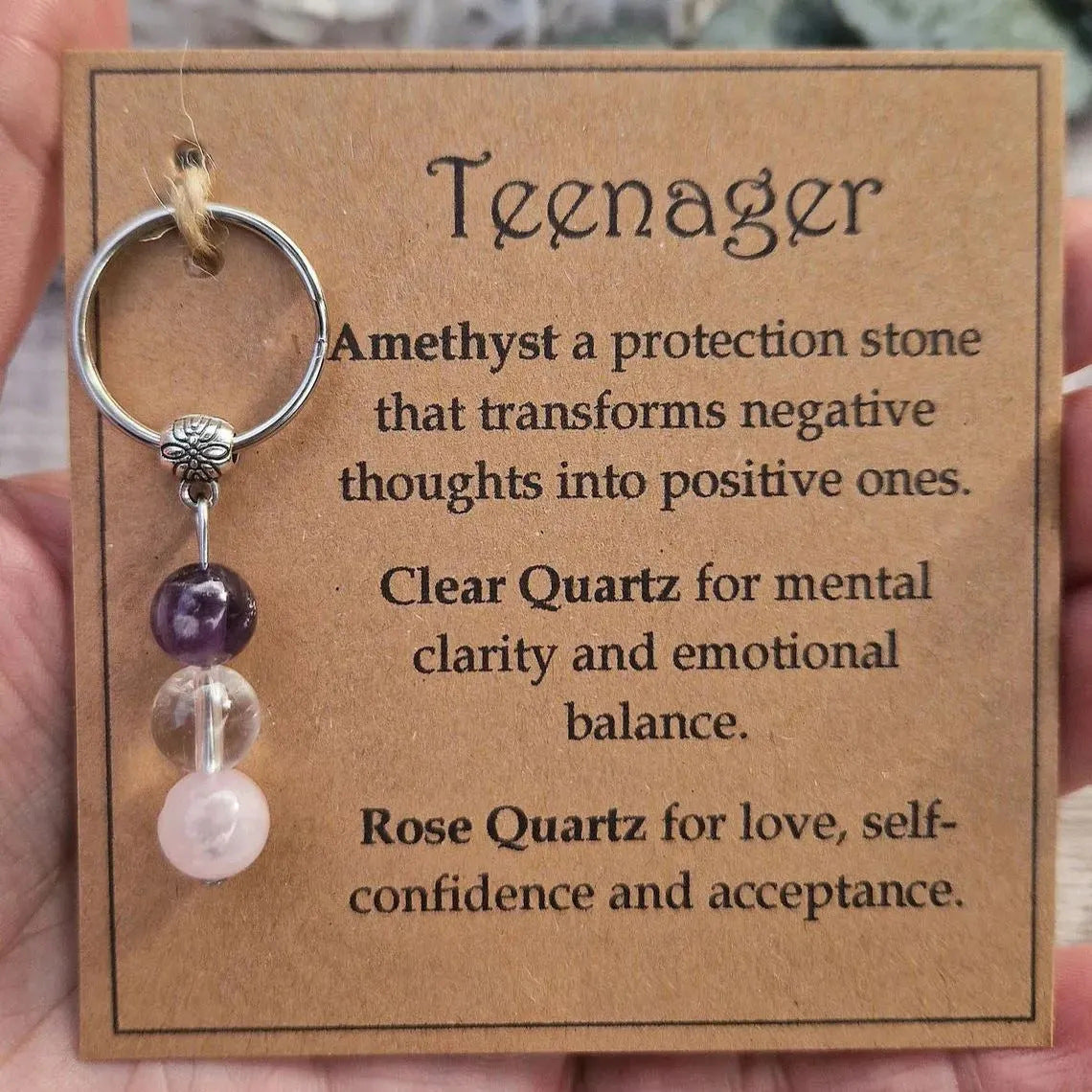 Teenager crystal intention keychain on meaning card