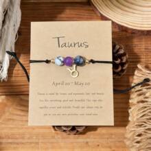 Taurus dainty zodiac charm bracelet on kraft card