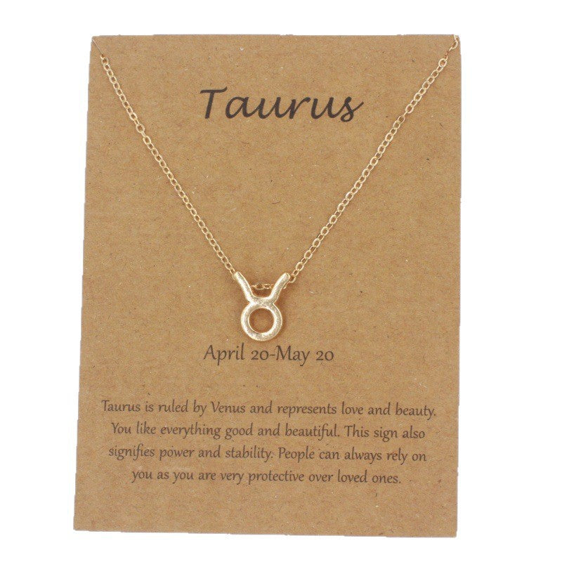 Taurus gold zodiac pendant necklace on meaning card