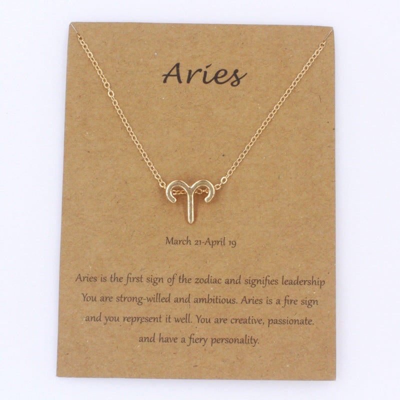 Aries gold zodiac pendant necklace on meaning card
