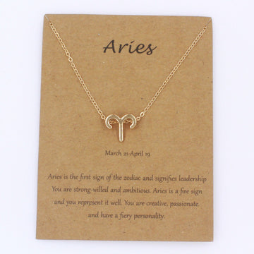 Aries gold zodiac pendant necklace on meaning card